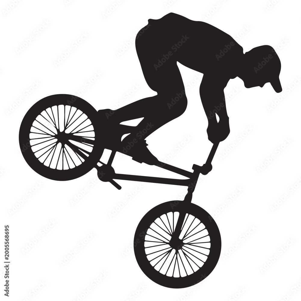 Fototapeta premium Silhouette of man performing trick on bmx bike