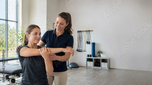 Physical Therapy Session with Arm Exercise Supportive Interaction Between Therapist and Patient Set Against a Brightly Lit Gym Environment