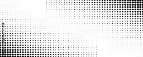 Photos Halftone dot pattern transitions from dark to light on a flat surface