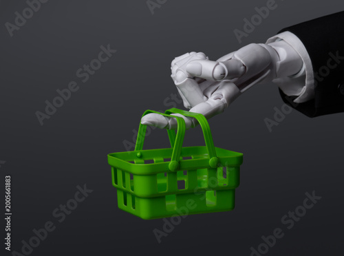 AI and automation in retail concept with robot hand carrying shopping basket