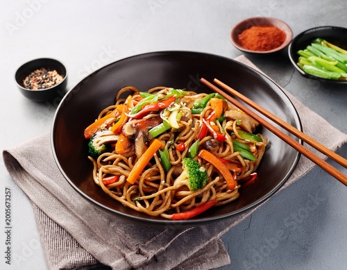 stir fried yakisoba noodles with vegetables and spices in the bowl asian cuisine