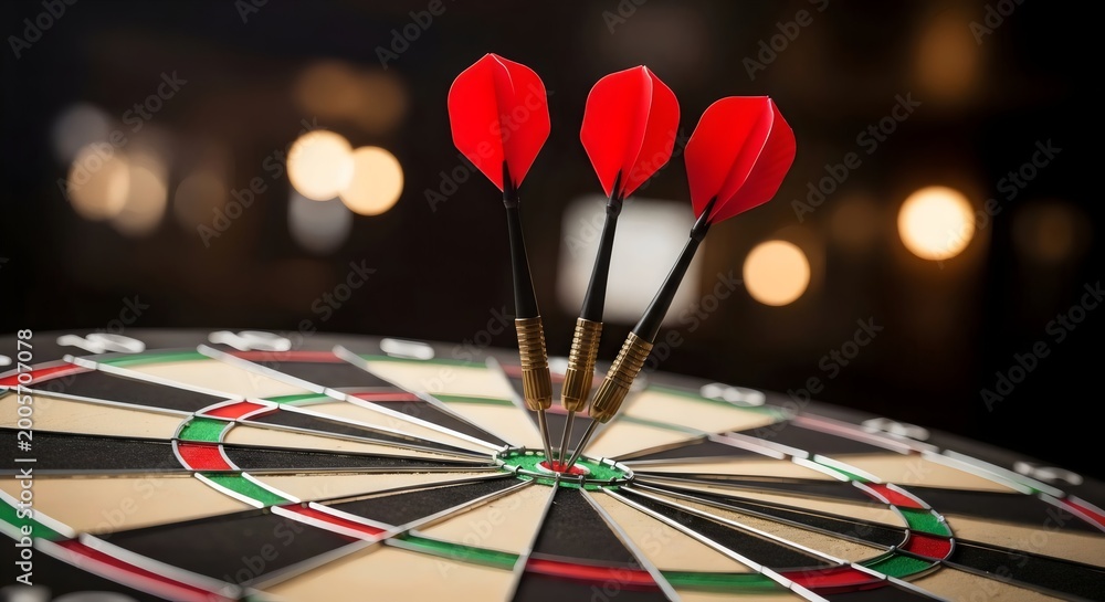 Fototapeta premium Close‑up dartboard with three darts embedded in bullseye symbolizing accuracy, success, and determination