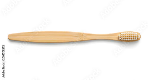 Eco friendly bamboo toothbrush with natural bristles and wooden handle isolated on a clean white background promoting sustainable oral hygiene and natural lifestyle choices