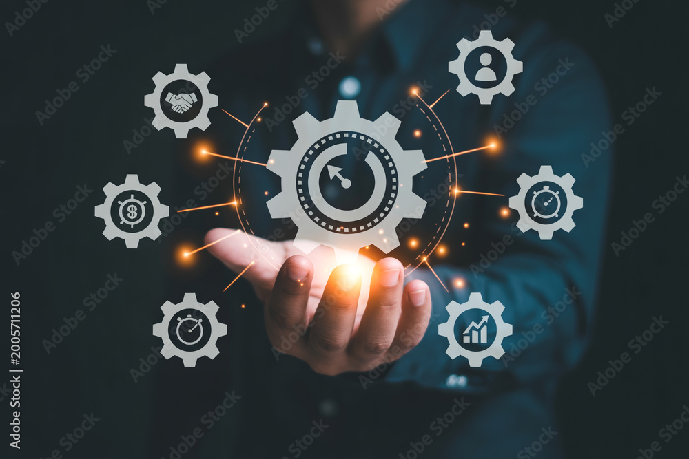 Obraz premium Businessman hand presenting glowing gear and process management icons.