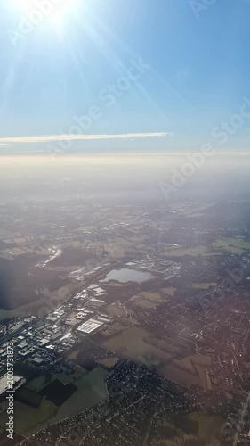 Airplane flying over Vienna Austria on sunny day