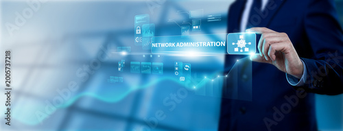 IT Technician Hand Holding Network Administration Interface on Digital Screen, configuring servers and connectivity. Ensuring stable infrastructure and secure enterprise communications.
