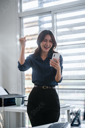 Free Download Woman exciting on smartphone winning in ecommerce offer - GFXLoad