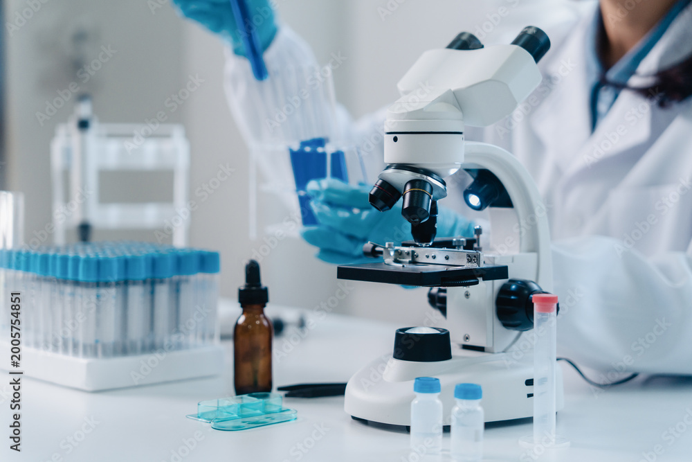 Fototapeta premium Scientist analyze biochemicals in a laboratory for health care research progress