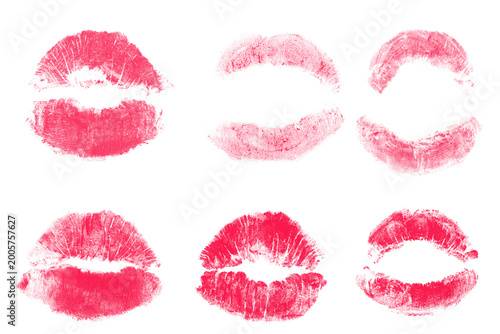 Fotografie Set of six pink and red lipstick kiss marks isolated on a blank backdrop