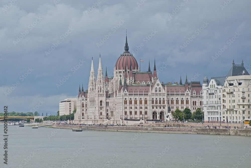 Obraz premium Side view on the Hungarian parliament along Danube river in Budapest, Hunagry