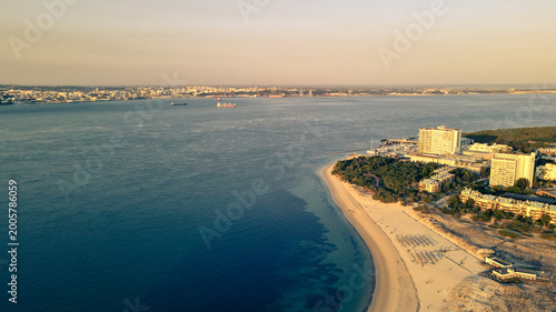 Photos Aerial view of Troia Peninsula luxury resort and coastal dunes at sunset, Setubal, Portugal