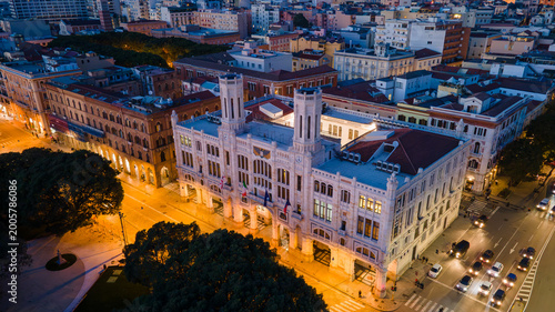 Fotografie lluminated Palazzo Civico (Town Hall) at night in Cagliari, Sardinia, Italy