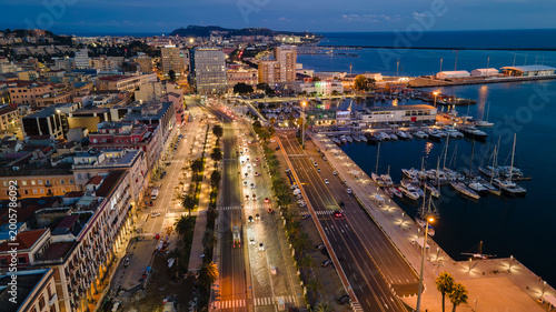 Fotografie Aerial evening view of Via Roma and the port of Cagliari, Sardinia, Italy