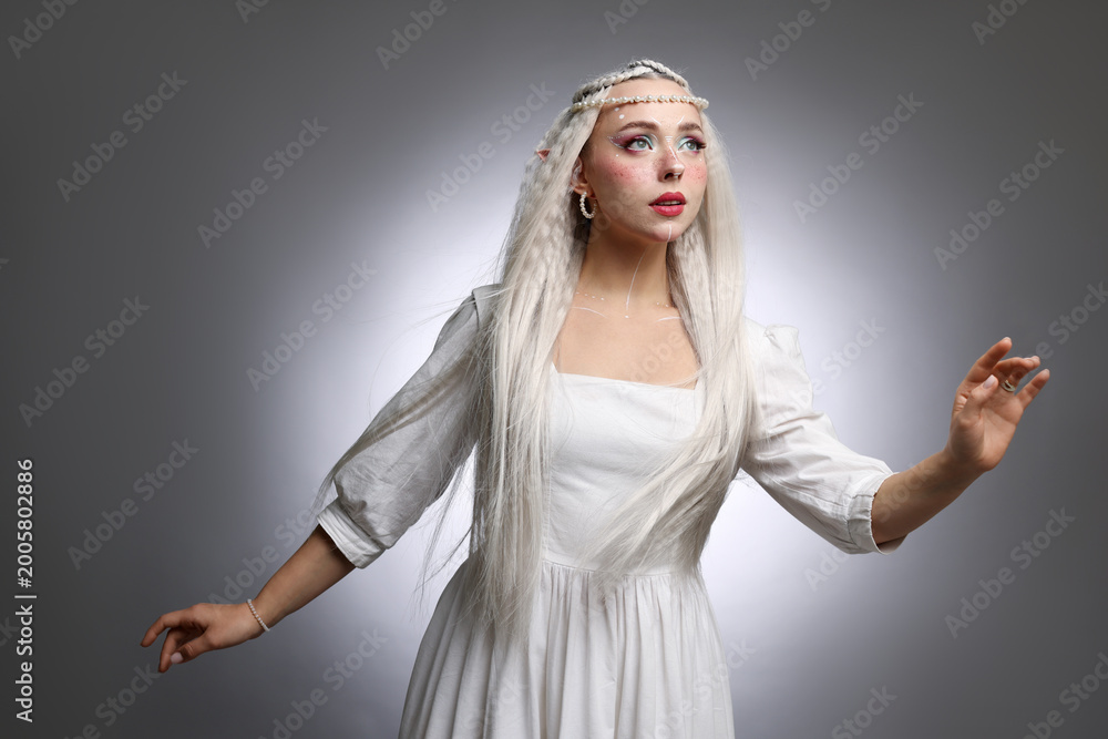 Obraz premium Beautiful elf girl on grey gradient background