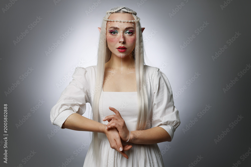 Obraz premium Beautiful elf girl on grey gradient background