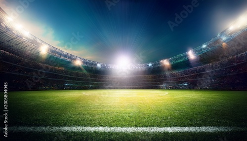 football stadium with spotlight spot on the green grass feilds full of attendance football match