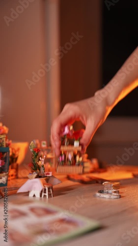 Close-up of female hands opening a bag of beads and details to create handmade jewelry. Craftswoman creating unique custom accessories in creative workshop. Handcrafted DIY jewelry artwork concept.