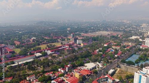 Aerial shot of south Mexico City skyline with smog and traffic