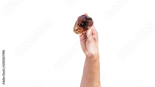 Chocolate cupcakes with cherry jam isolated on a white background. Chocolate muffin in hand.