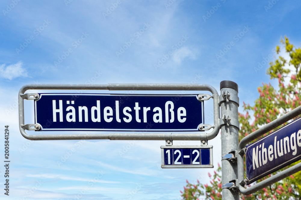 Fototapeta premium Street name Händelstrase - engl alley of Händel - in Frankfurt on a blue enamel sign