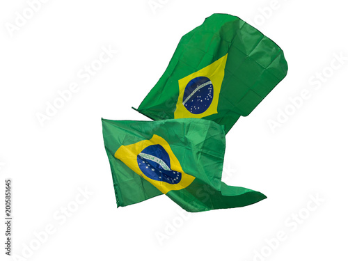 Brazilian flag cut out and isolated is waving in the wind, national symbol of Brazil with green, yellow and blue colors, representing patriotism, culture, identity and government.