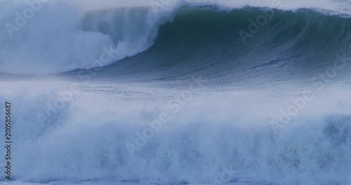 Extreme wave action turbulent sea powerful crash slow motion