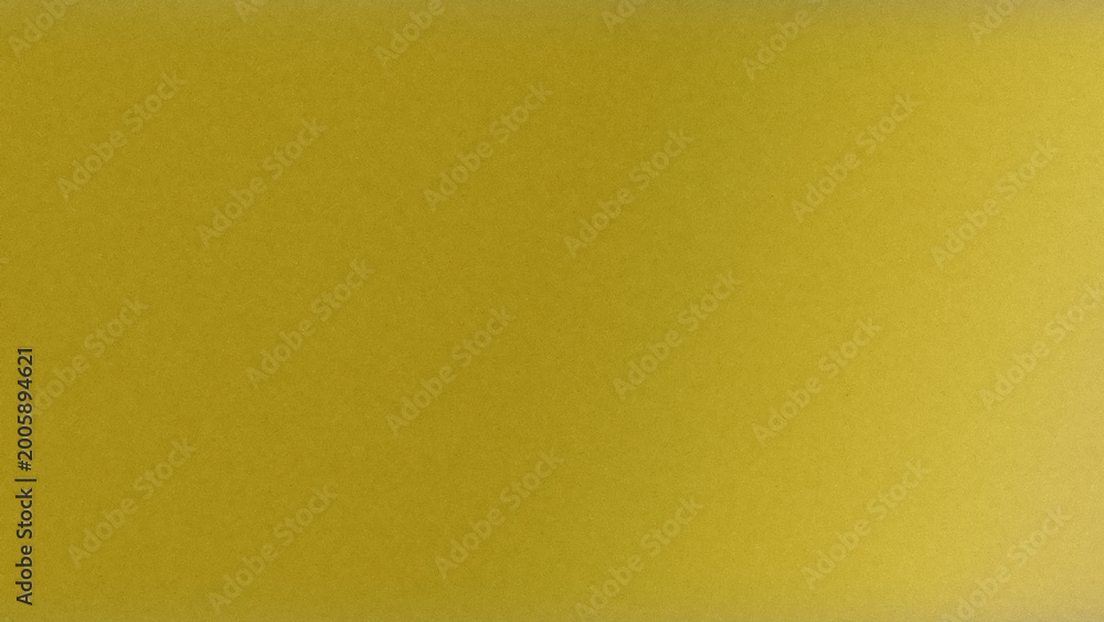 Fototapeta premium Vivid yellow gradient surface with smooth transitions and soft grain, bringing cheerful, energetic warmth to creative layouts, marketing materials, and digital designs.