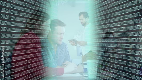 Seated man writing, 0 or 1 tunnel pulsing, peer approaching with tablet for tech review