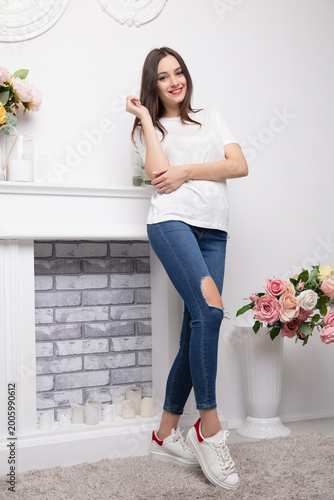 Pretty brunette dressed in jeans