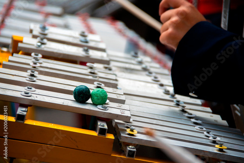 Marching band glockenspiel performance in outdoor parade with natural light