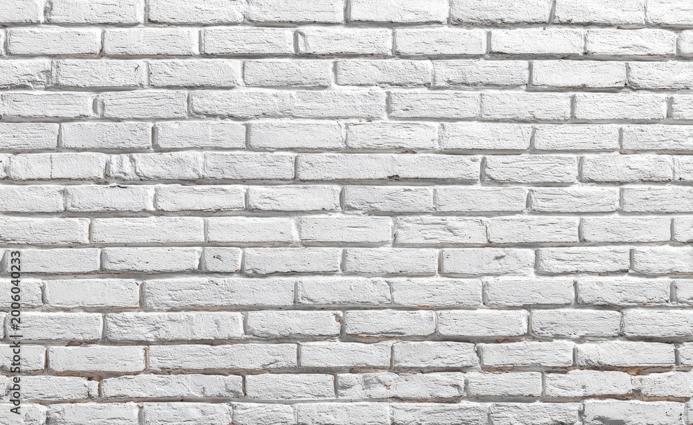 Obraz premium Textured white painted brick wall, evenly spaced and stacked