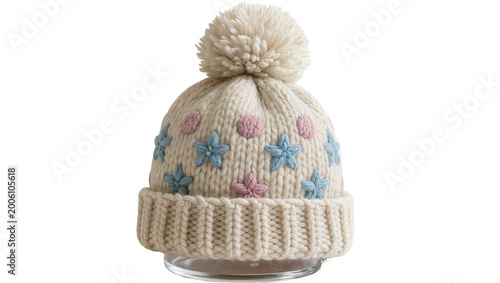 Fotografie Cream knitted beanie with blue stars and pink dots, isolated on transparent back