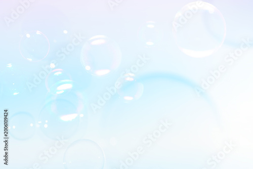 Beautiful Clear Soap Bubbles Floating in The Air. Celebration Festive Backdrop. Freshness Soap Suds Bubbles Water. Blue and White Gradient Textured.	