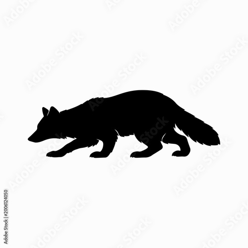 Black silhouette of a badger walking