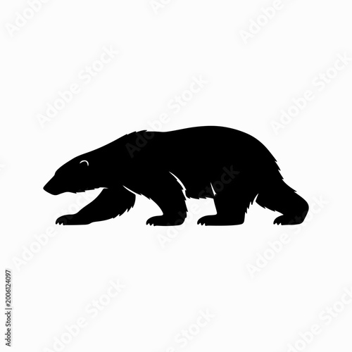 Black bear silhouette walking in nature