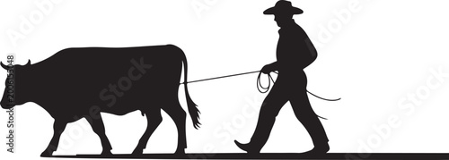Fotografi Cowboy leading a cow with a rope