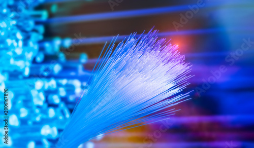 Photos Fiber optics network cable on technology background
