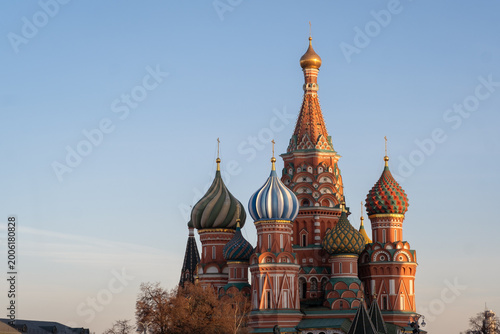 St. Basil's Cathedral with colorful onion domes against a clear sky in Moscow, showcasing intricate architectural details and vibrant colors