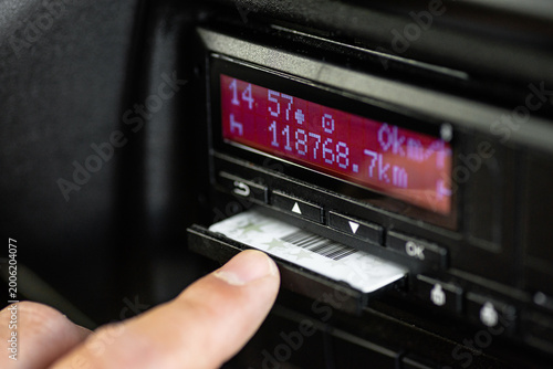 Tablou pe pânză Hand inserting driver card into digital tachograph