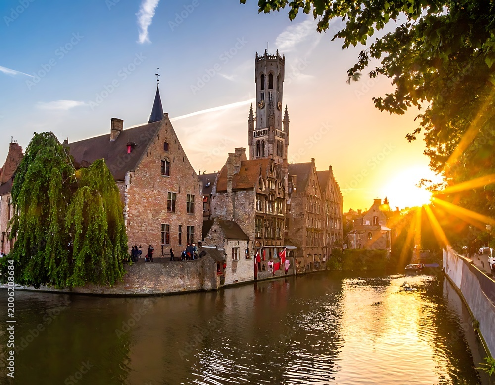 Fototapeta premium Serene sunset over a historic European town's canal