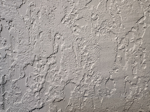 Textured gray wall with rough, uneven surface