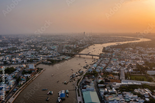 Tableau sur toile Cai Rang Floating Market in Can Tho, Vietnam – a popular tourist destination showcasing the riverine culture of the Mekong Delta – attracts both domestic and international visitors