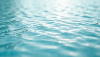 Turquoise water surface ripples with soft sunlight reflecting on gentle waves for cosmetic brand advertising, spa editorial backgrounds and wellness product mockups