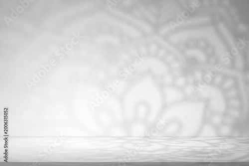 Eid Mubarak.Minimal Islamic background with soft sunlight casting arabesque geometric window shadows on grey wall.Vector studio room for Ramadan Kareem,Eid al Fitr,Mosque interior spiritual design