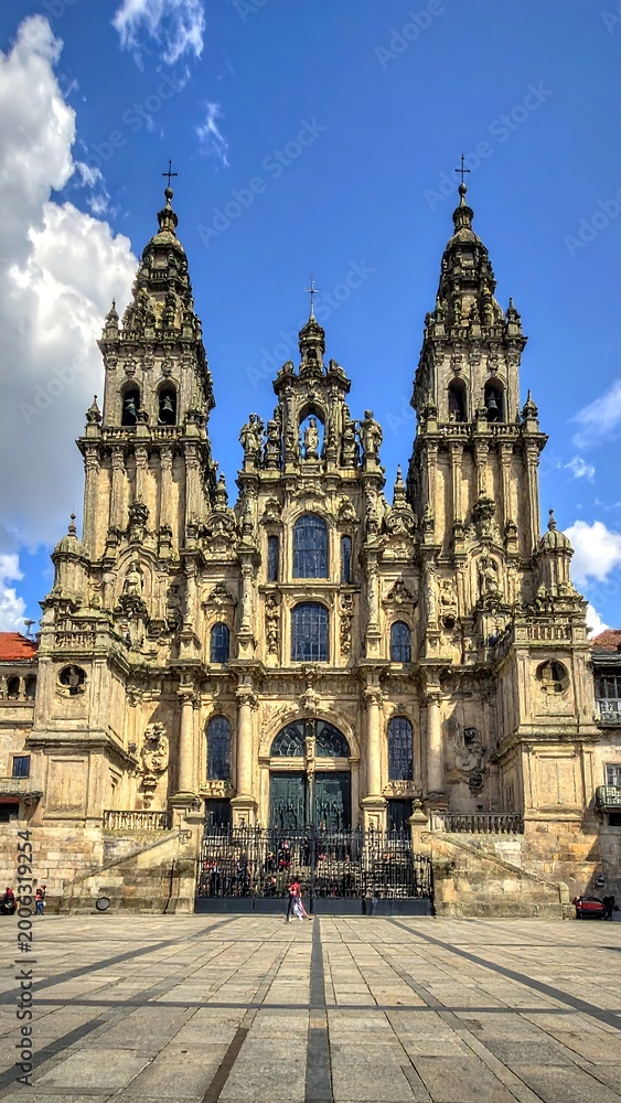 Fototapeta premium A large, ornate cathedral with two towers stands on a square