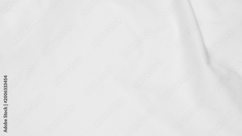 Fototapeta premium shot showing the subtle texture and soft folds of a white fabric surface.