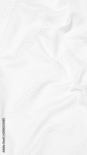 Quadro su tela A vertical, high angle shot of a white fabric surface characterized by soft, flo