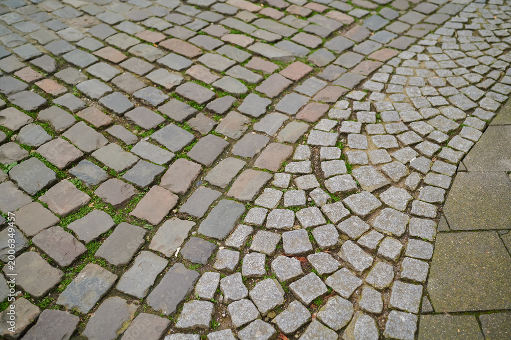 Fototapeta premium Cobblestone path through city history