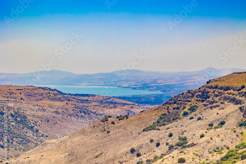 Photos High angle wide shot of arid rocky hills and green bushes in the Golan Heights o