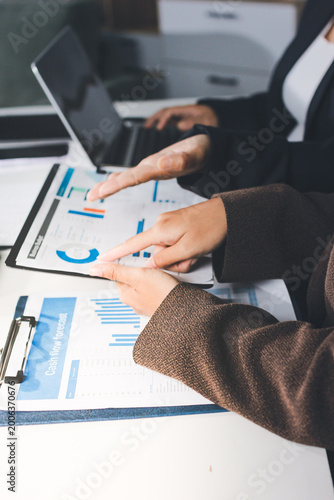 Accountants processing financial documents and taxes, managing corporate finance in a modern office. Audit and taxes in business